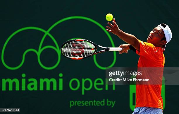 Tatsuma Ito of Japan plays a match against Gael Monfils of France during Day 6 of the Miami Open presented by Itau at Crandon Park Tennis Center on...