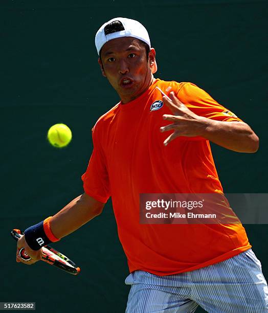 Tatsuma Ito of Japan plays a match against Gael Monfils of France during Day 6 of the Miami Open presented by Itau at Crandon Park Tennis Center on...