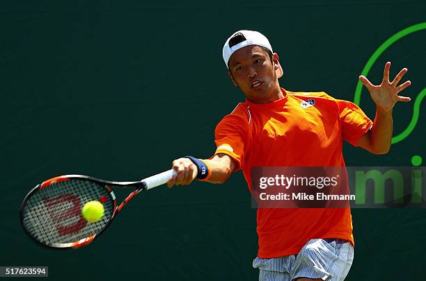 Tatsuma Ito of Japan plays a match against Gael Monfils of France during Day 6 of the Miami Open presented by Itau at Crandon Park Tennis Center on...