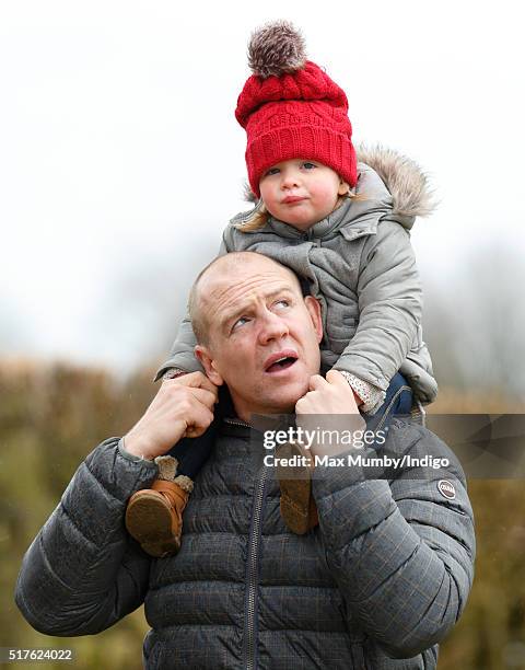 Mike Tindall carries daughter Mia Tindall on his shoulders as they attend the Gatcombe Horse Trails at Gatcombe Park, Minchinhampton on March 26,...