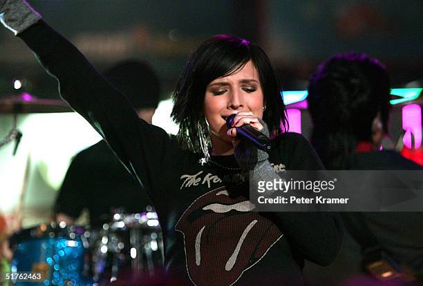 Singer Ashlee Simpson performs on MTV's Total Request Live at MTV Times Square Studios November 18, 2004 in New York City
