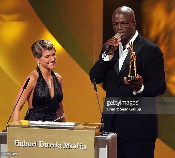 Singer Seal speaks after receiving his Bambi Award from German singer Jeanette Biedermann at the Bambi Awards 2004 at the Theater im Hafen on...