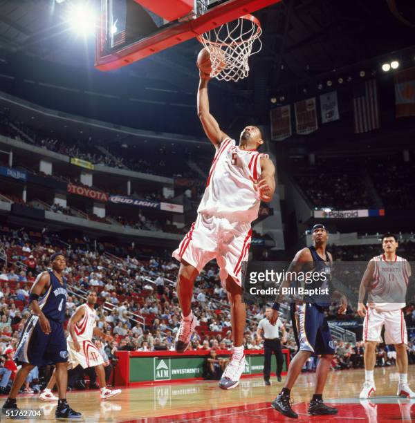 Juwan Howard of the Houston Rockets makes a layup against the Memphis Grizzlies at Toyota Center on November 9, 2004 in Houston, Texas. The Rockets...