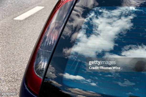 reflection of clouds - car window stockfoto's en -beelden