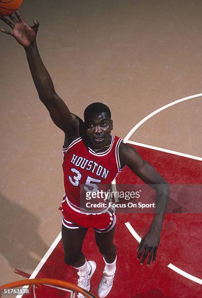 Akeem Olajuwon of the Houston Cougars poses for a jump shot circa 1983.