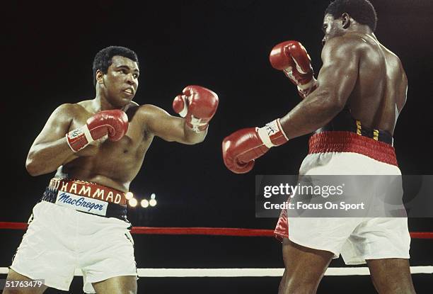 Muhammad Ali throws a left hook and misses Trevor Berbick at the Queen Elizabeth Sports Centre on December 11, 1981 in Nassau, Bahamas. Berbick...