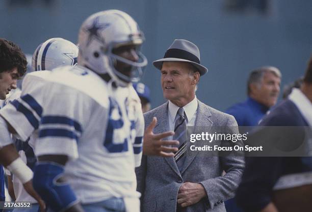 Dallas Cowboys' coach Tom Landry talk to a player. Tom Landry directed the Dallas Cowboys to 20 consecutive winning seasons from 1966-85 and two...