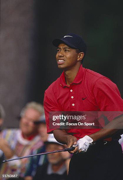 Tiger Woods reacts to a poor shot during the Masters Tournament at the Augusta National Golf Club on April 13, 1997 in Augusta, Georgia. Tiger Woods...