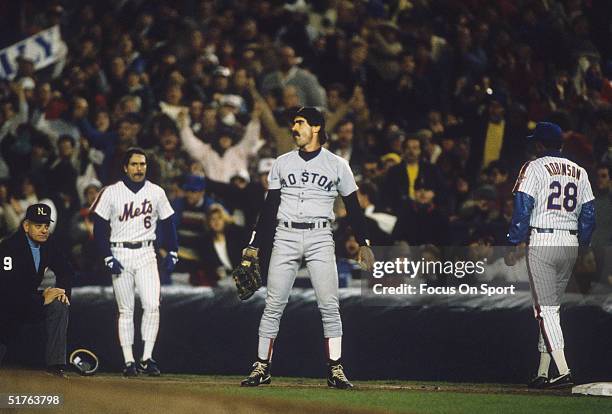 First baseman Bill Buckner of the Boston Red Sox doesn't get the call he wanted while Wally Backman of the New York Mets is safe at first base during...