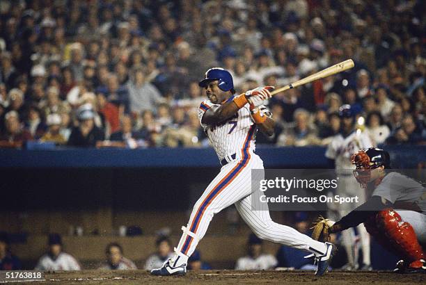 Kevin Mitchell of the New York Mets takes a big cut during the World Series against the Boston Red Sox at Shea Stadium on October 1986 in Flushing,...