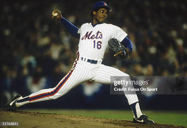 Pitcher Dwight Gooden of the New York Mets rears backbefore firing a pitch during Game Two of the World Series against the Boston Red Sox at Shea...