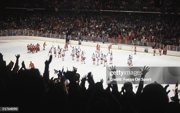 The United States hockey team celebrates on the ice after defeating the Soviet Union team on February 22, 1980 during the 1980 Winter Olympics in...