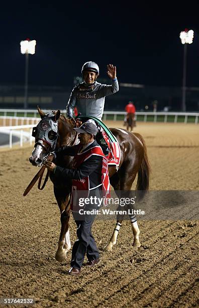 Victor Espinoza celebrates riding California Chrome to victory in the Dubai World Cup Sponsored By Emirates Airline as part of the duirng the Dubai...