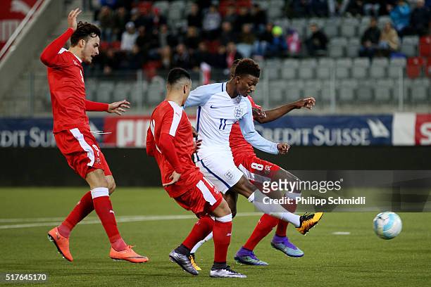 Demarai Gray of England U21 shoots the ball under pressure during the European Under 21 Qualifier match between Switzerland U21 and England U21 at...