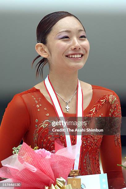 Miki Ando celebrates winning the Women's Singles during day three of the All Japan Junior Figure Skating Championships at Kyoto Aquarena on November...