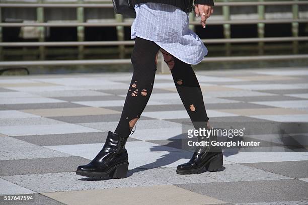 Emily Mercer wearing shirt dress by OAK, black knitted sweater by Levi's, black ripped tights, rings by Epiphanie, Alison Lou, Elizabeth + James,...