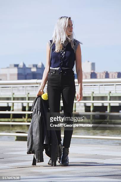 Emily Mercer wearing vintage grey turtleneck sleeveless sweater, blue Urban Outfitters navy top with tie, black high waisted BLK DNM pants, PaPer...