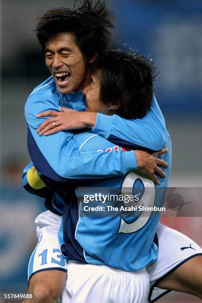 Nobuo Kawaguchi of Jubilo Iwata celebrates scoring his team's second goal with his team mate Masashi Nakayama during the J.League match between...