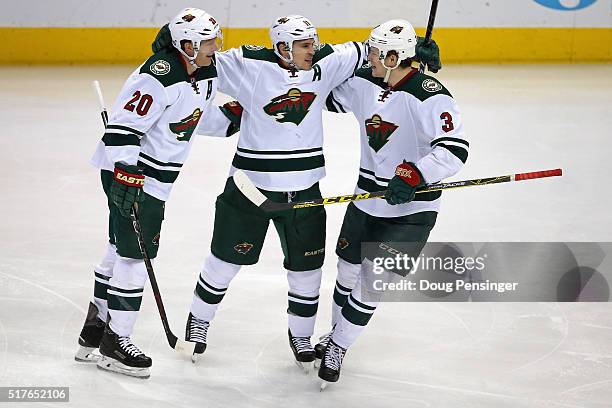 Zach Parise of the Minnesota Wild celebrates his goal against the Colorado Avalanche to take a 3-0 lead in the third period with teammates Ryan Suter...