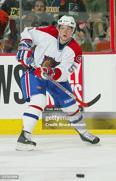 Corey Locke of the Hamilton Bulldogs makes a pass play against the Philadelphia Phantoms during the American Hockey League game on October 22, 2004...