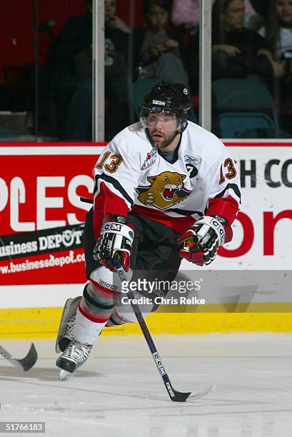 Josh Garbutt of the Prince George Cougars defends against the Vancouver Giants during the Western Hockey League game at Pacific Coliseum on October...