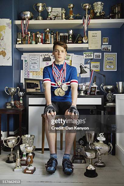 boy with trophies - medal stock pictures, royalty-free photos & images