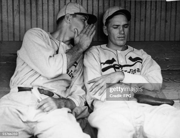 American baseball player Paul Dean whispers to his brother Dizzy Dean , both of the St. Louis Cardinals, shortly before the start of game one of the...