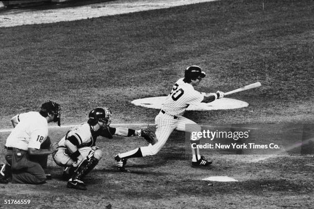 American baseball player Bucky Dent hits a single for the New York Yankees during a game against the Detroit Tigers at Yankee Stadium, New York, New...