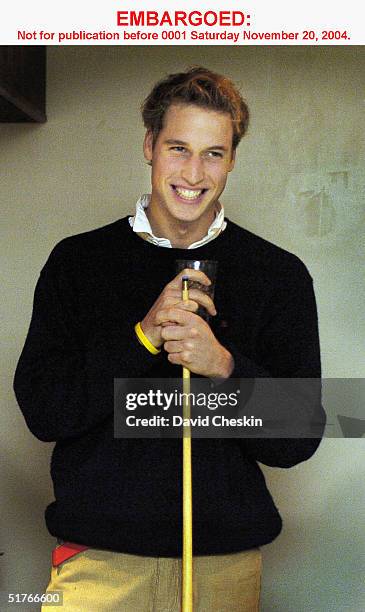 Prince William plays pool with friends at a pub on November 15, 2004 in St Andrews, Scotland. The Prince is in the last year of his four-year course...