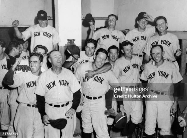Members of the New York Yankees celebrate a victory over the Boston Red Sox at Fenway Park, Boston, Massachusetts, September 4, 1941. Players...