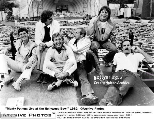 British comedy troupe Monty Python including Michael Palin, Terry Jones, Eric Idle, Graham Chapman , Terry Gilliam, and John Cleese, lounge about at...