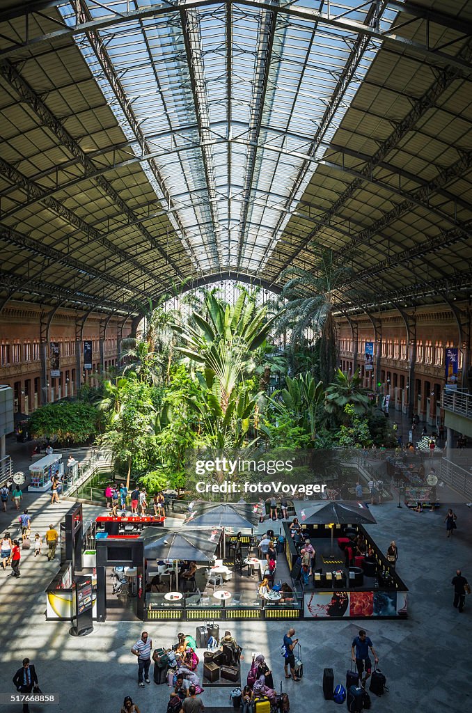 Madrid Atocha railway station busy concourse green tropical garden Spain