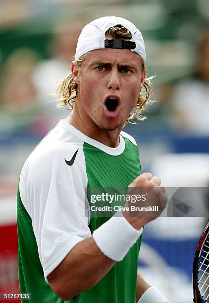 Lleyton Hewitt of Australia celebrates a point over Gaston Gaudio of Argentina during the round robin stage of the Tennis Masters Cup November 19,...