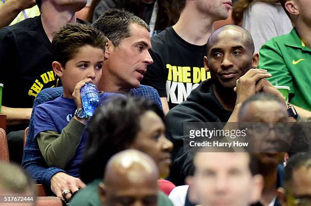 Agent Rob Pelinka talks with Kobe Bryant during the NCAA Men's Basketball Tournament West Regional Final at Honda Center on March 26, 2016 in...