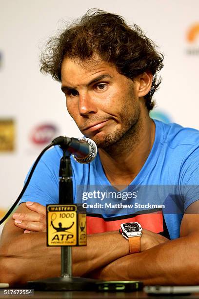 Rafael Nadal of Spain fields questions from the media after retiring from his match against Damir Dzumhur of Bosnia and Herzegovina after feeling...