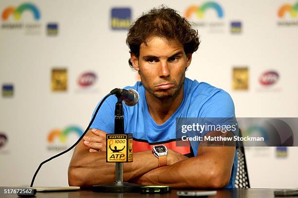 Rafael Nadal of Spain fields questions from the media after retiring from his match against Damir Dzumhur of Bosnia and Herzegovina after feeling...