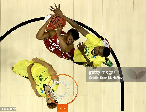 Chris Boucher of the Oregon Ducks blocks the shot of Christian James of the Oklahoma Sooners in the second half in the NCAA Men's Basketball...