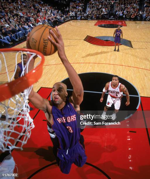 Loren Woods of the Toronto Raptors takes the ball to the basket during a game against the Portland Trail Blazers at The Rose Garden on November 13,...