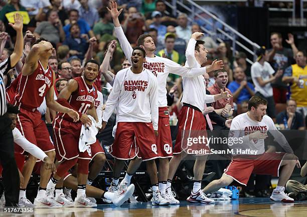 The Oklahoma Sooners bench cheers late in the second half while taking on the Oregon Ducks in the NCAA Men's Basketball Tournament West Regional...