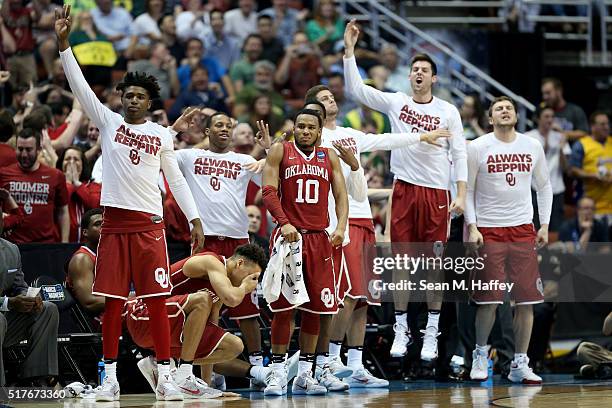 The Oklahoma Sooners bench cheers late in the second half while taking on the Oregon Ducks in the NCAA Men's Basketball Tournament West Regional...