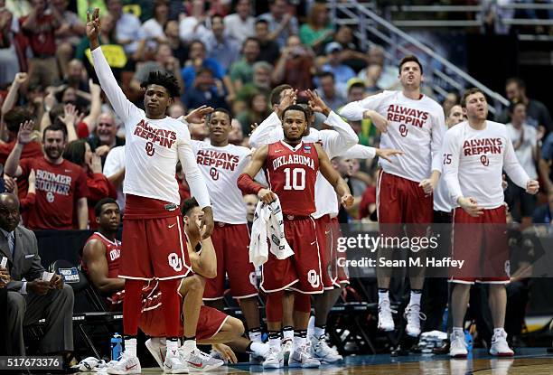 The Oklahoma Sooners bench cheers late in the second half while taking on the Oregon Ducks in the NCAA Men's Basketball Tournament West Regional...