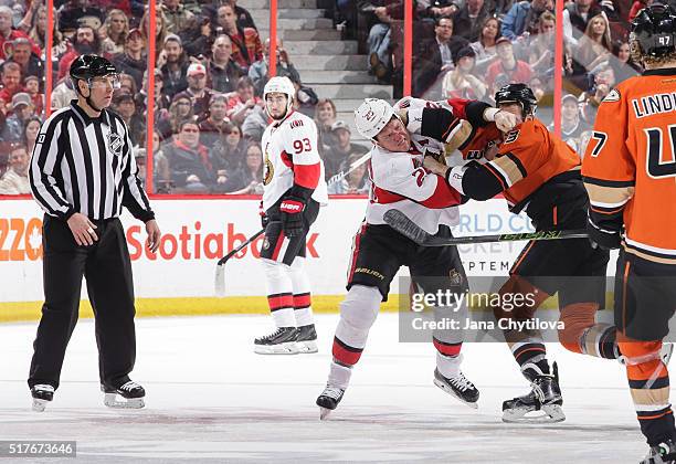 Chris Neil of the Ottawa Senators throws punches against Clayton Stoner of the Anaheim Ducks at Canadian Tire Centre on March 26, 2016 in Ottawa,...