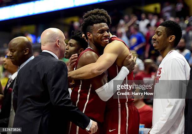 Buddy Hield of the Oklahoma Sooners celebrates as he is taken out of the game late in the second half before the Sooners 80-68 victory against the...