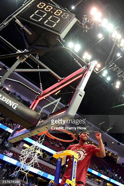 Buddy Hield of the Oklahoma Sooners cuts down a piece of the net after the Sooners 80-68 victory against the Oregon Ducks in the NCAA Men's...