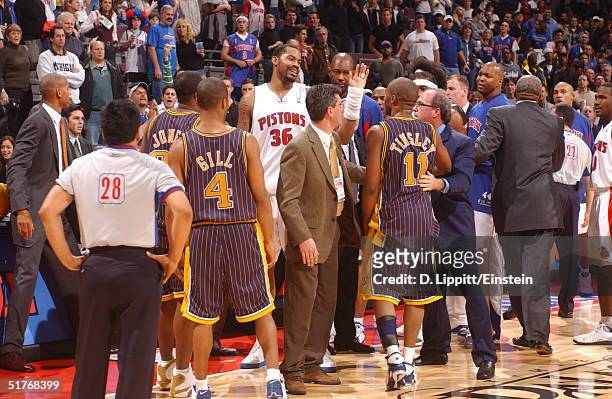The Indiana Pacers and the Detroit Pistons mix it up in a scuffle on November 19, 2004 during their game at the Palace of Auburn Hills, in Auburn...