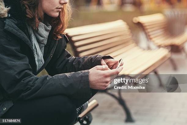 cell phone break up - girl sitting stock pictures, royalty-free photos & images