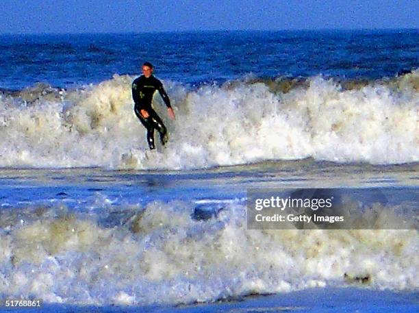 Prince William surfing at St Andrews in Scotland, where he is in the last year of his four-year university course.