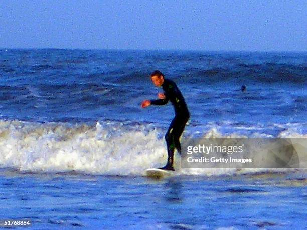 Prince William surfing at St Andrews in Scotland, where he is in the last year of his four-year university course.