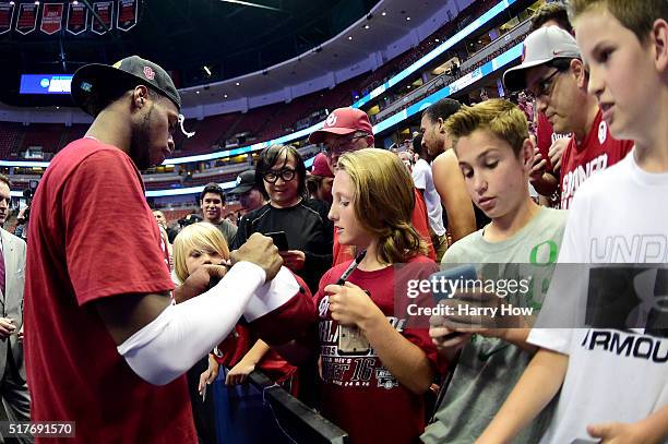 Buddy Hield of the Oklahoma Sooners signs autographs after the Sooners 80-68 victory against the Oregon Ducks in the NCAA Men's Basketball Tournament...