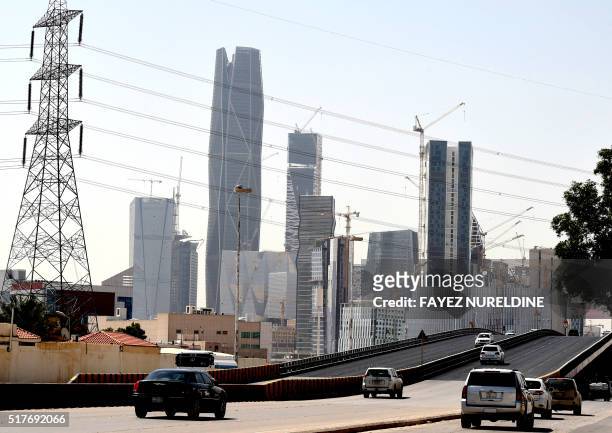 Picture taken on March 9, 2016 shows towers under construction at the King Abdullah Financial District in the Saudi capital Riyadh. Towers in the...
